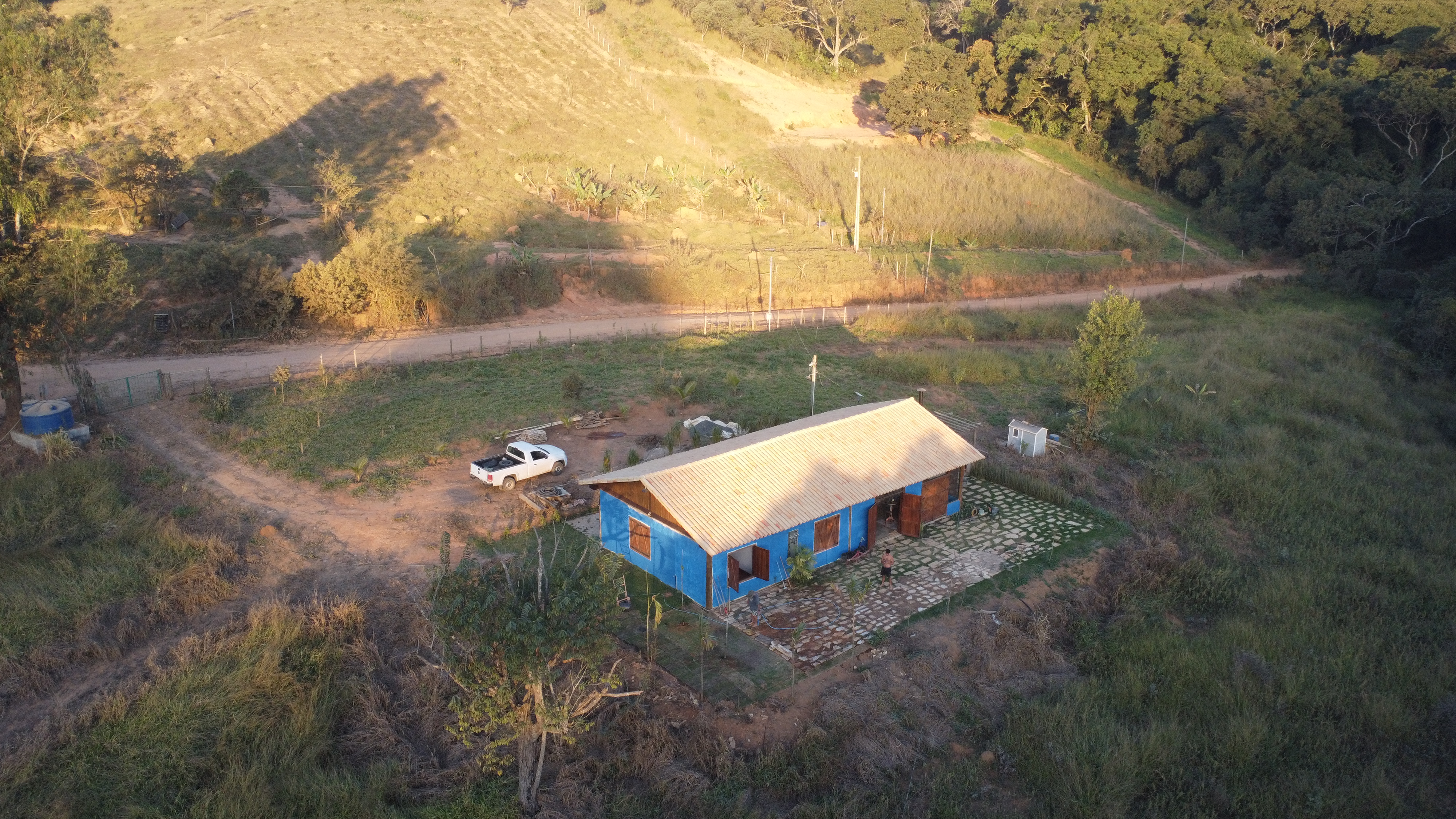 Completed homestead from above, golden hour